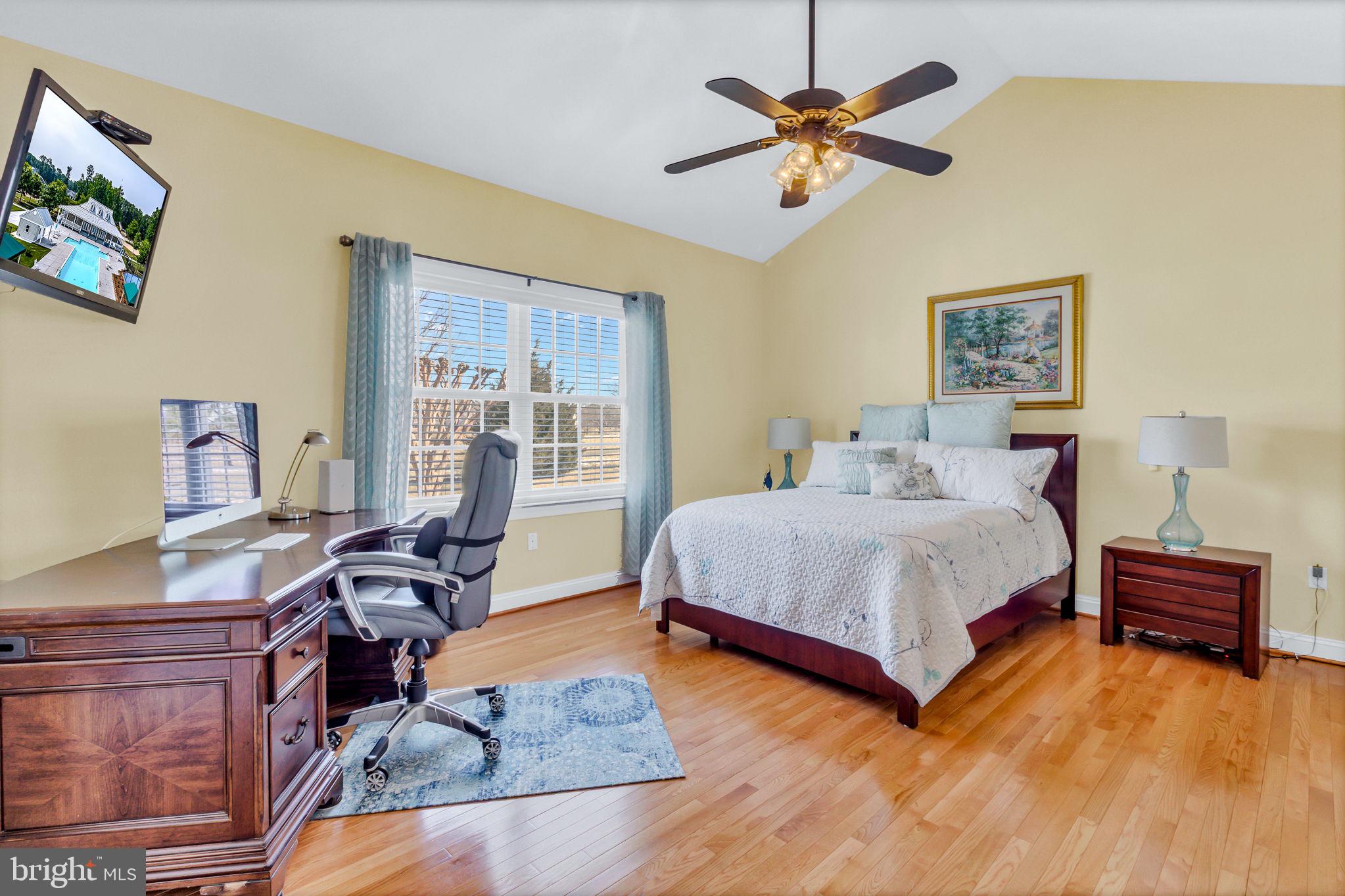 88 Old Field Road Irvington, VA 22480 - Photo 10 of 55 a bedroom with a bed and a desk