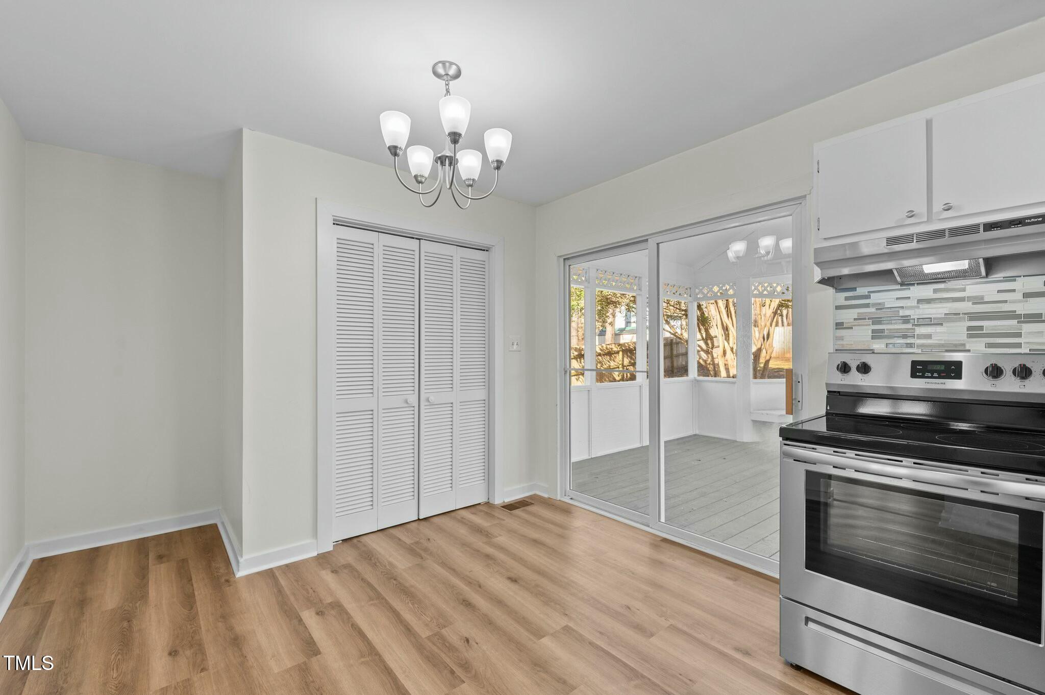 1014 Holden Road Youngsville, NC 27596 - Photo 20 of 54 a view of a kitchen with a stove cabinets and wooden floor