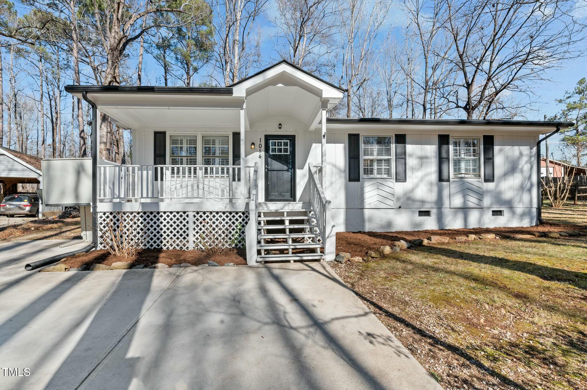 1014 Holden Road Youngsville, NC 27596 - Photo 2 of 54 a front view of a house with garden