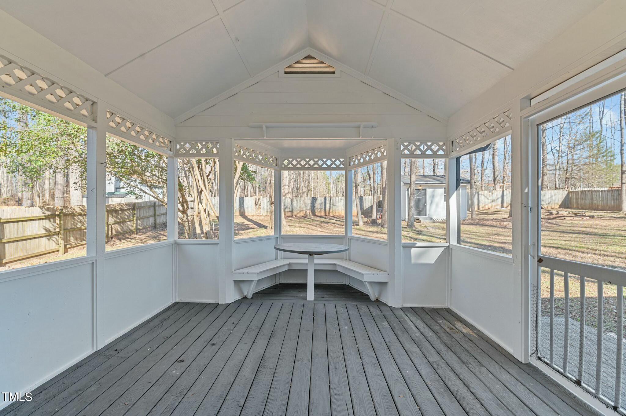 1014 Holden Road Youngsville, NC 27596 - Photo 23 of 54 a view of a room with wooden floor and iron stairs