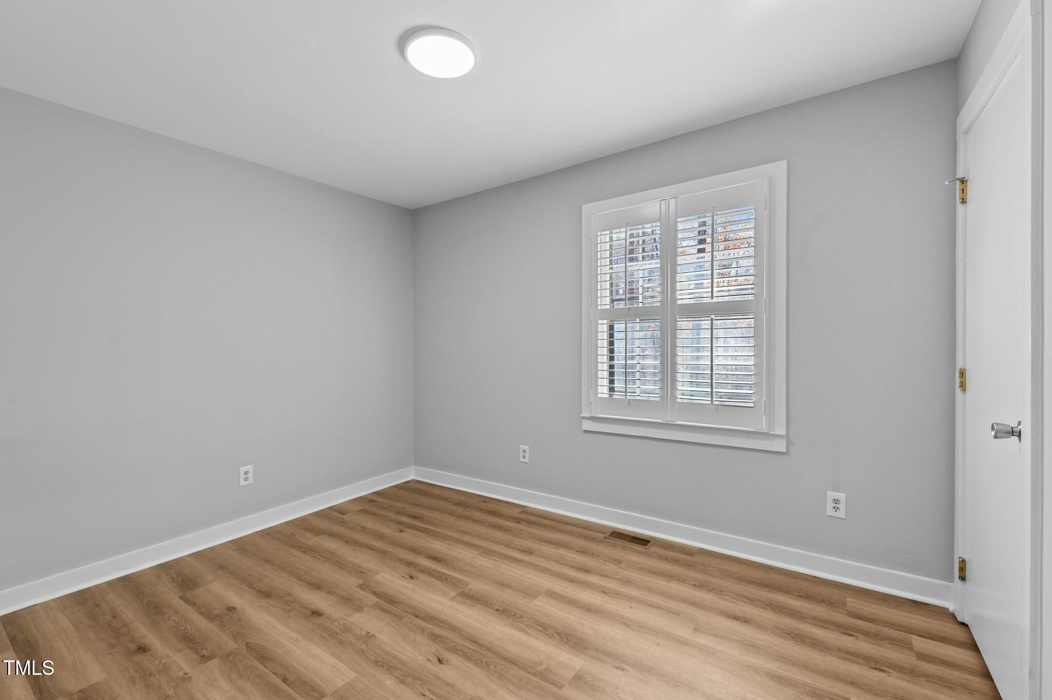 1014 Holden Road Youngsville, NC 27596 - Photo 26 of 54 a view of empty room with wooden floor