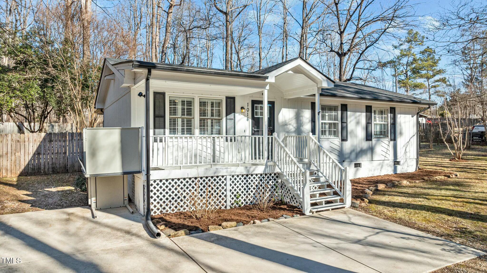 1014 Holden Road Youngsville, NC 27596 - Photo 50 of 54 a front view of a house with a iron gate