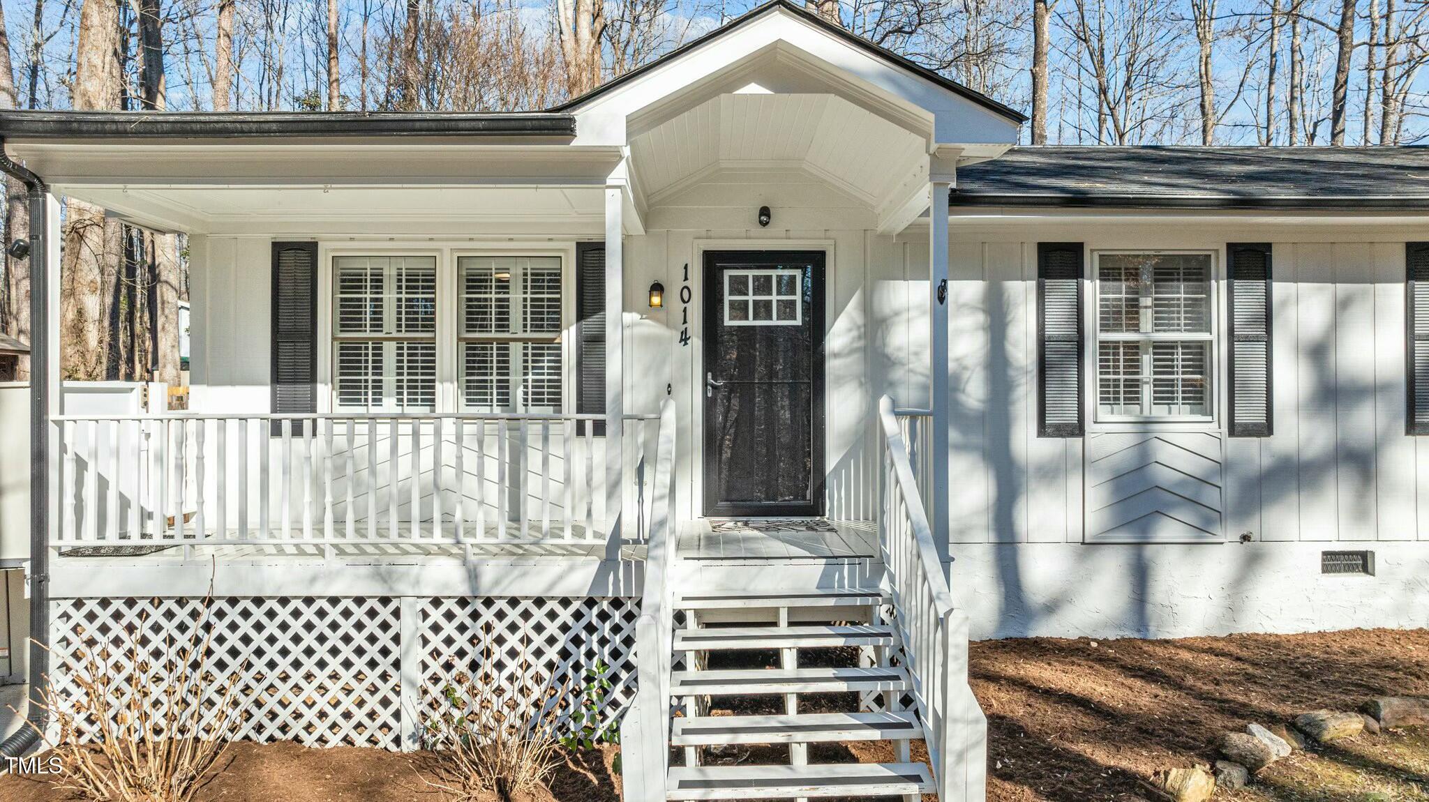1014 Holden Road Youngsville, NC 27596 - Photo 9 of 54 a front view of a house with a fence