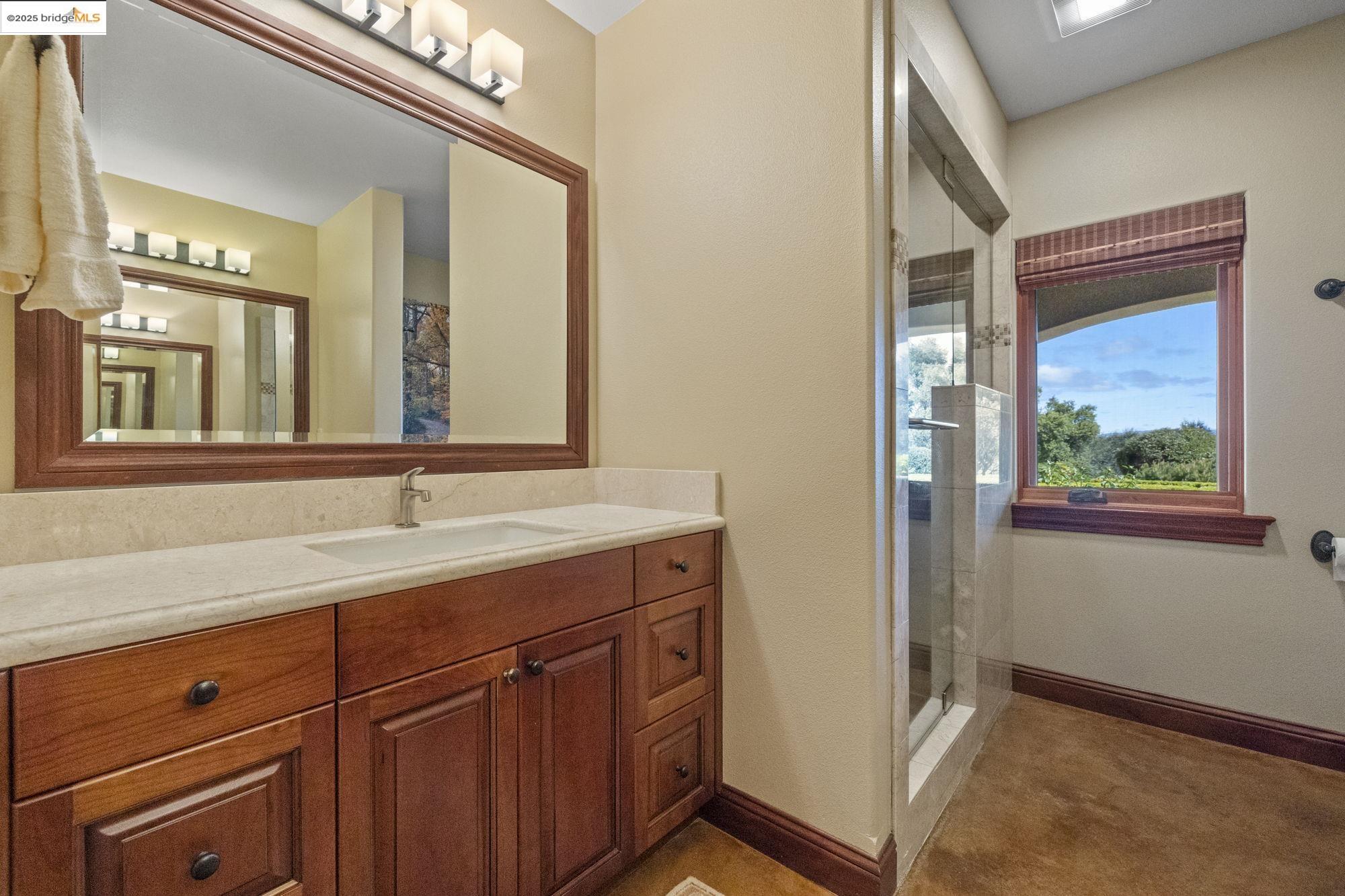 10270 Slate Rim Road Sonora, CA 95370 - Photo 31 of 55 a bathroom with a sink and a mirror