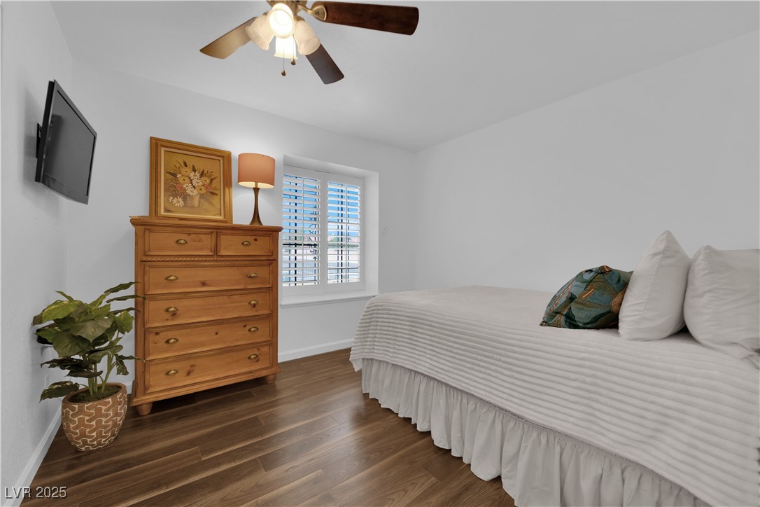 148 Triberg Court Henderson, NV 89074 - Photo 19 of 27 2nd Bedroom with a ceiling fan, seated window, and built in's closet storage space and drawers in closet.