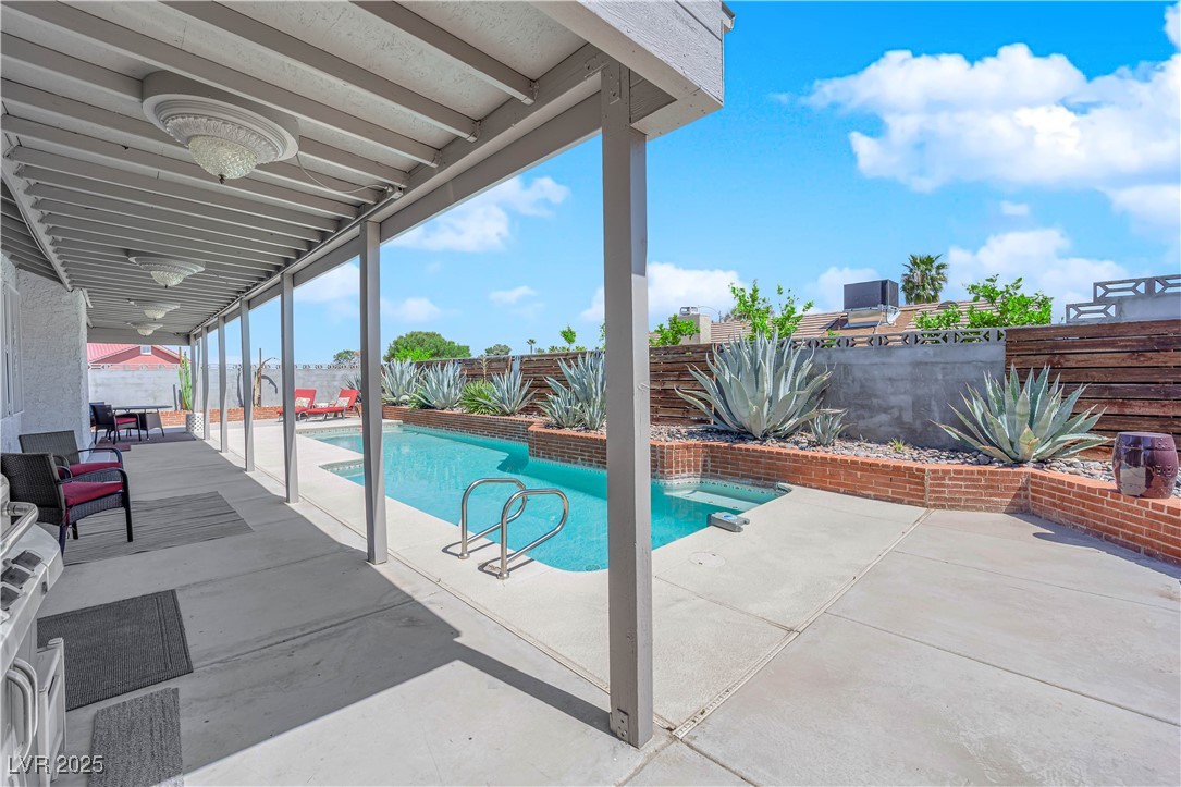 148 Triberg Court Henderson, NV 89074 - Photo 24 of 28 View of swimming pool featuring a covered patio, pool, and a fenced backyard