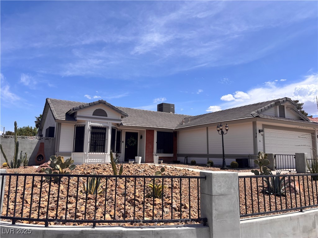 148 Triberg Court Henderson, NV 89074 - Photo 28 of 28 Single story home featuring a garage, a tiled roof, and fence private yard