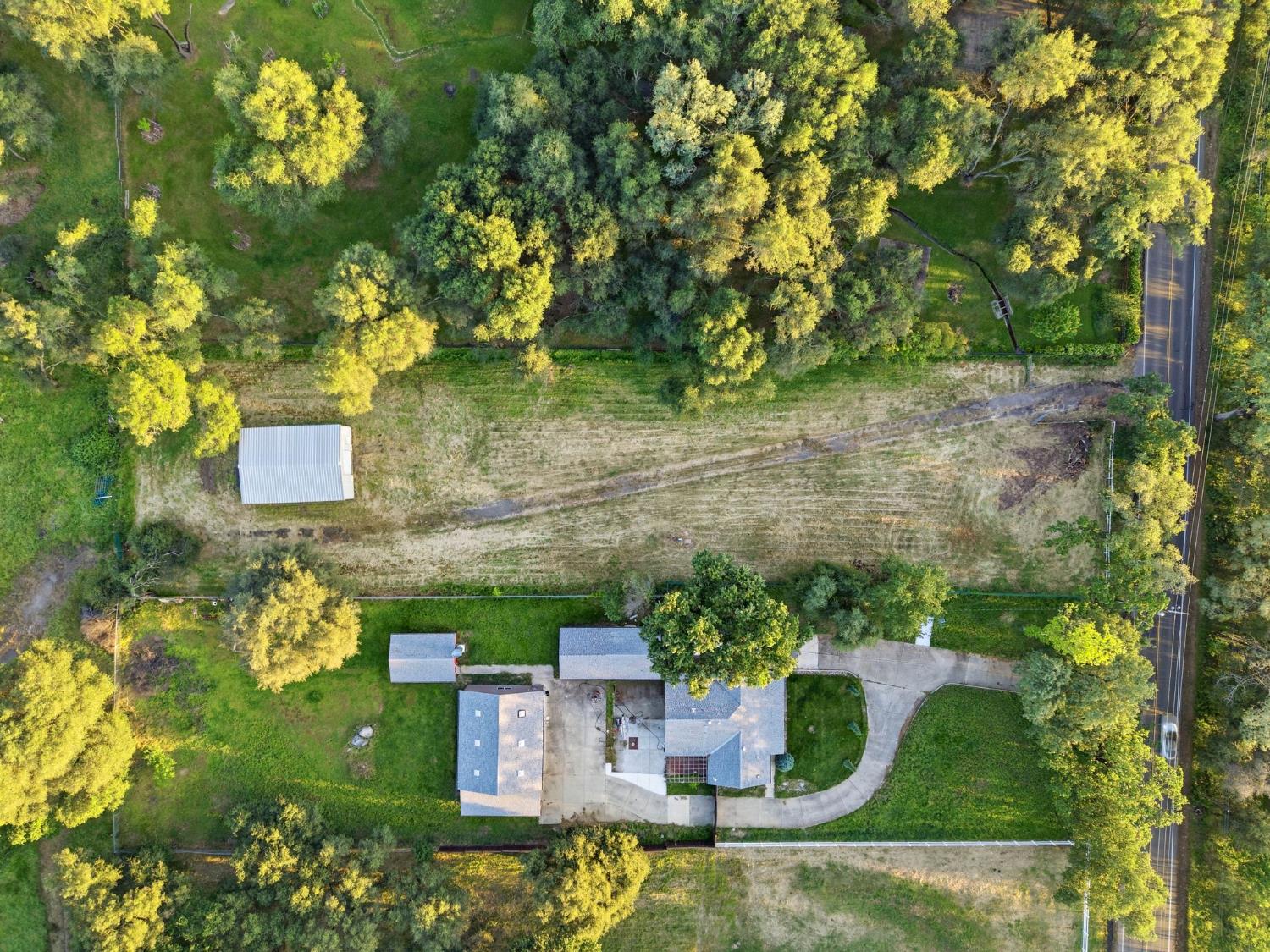 6845 Barton Road Granite Bay, CA 95746 - Photo 18 of 33 a view of a house with a yard
