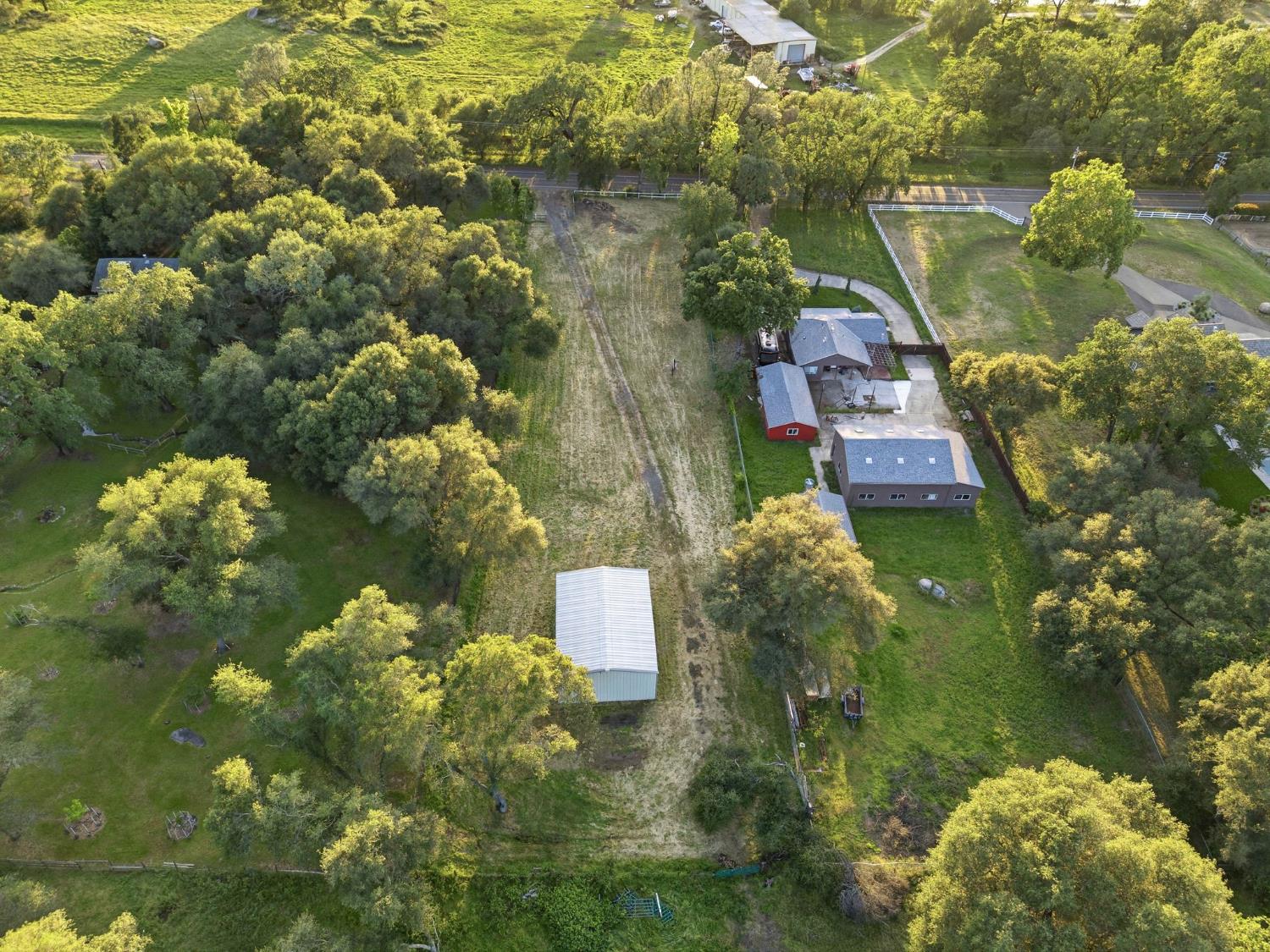 6845 Barton Road Granite Bay, CA 95746 - Photo 22 of 33 a aerial view of a house with a lake view