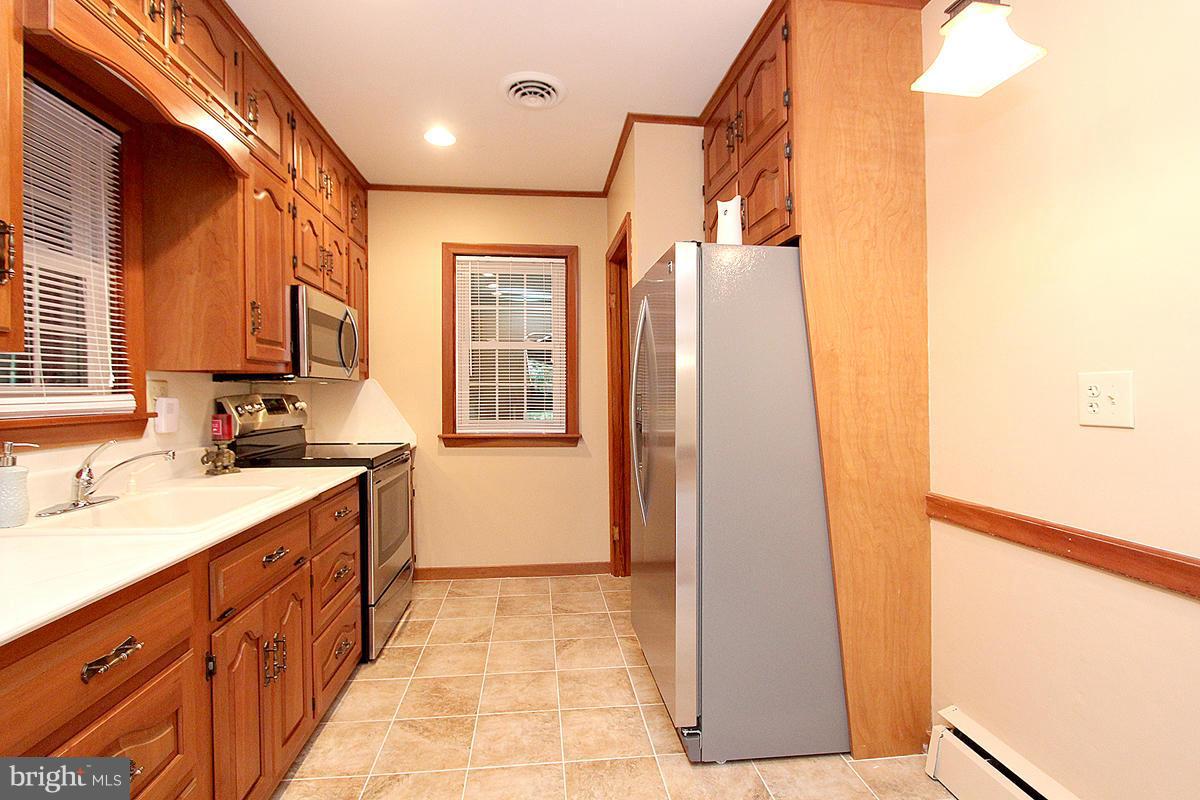5017 Teen Barnes Road Frederick, MD 21703 - Photo 12 of 30 a bathroom with a sink and a mirror