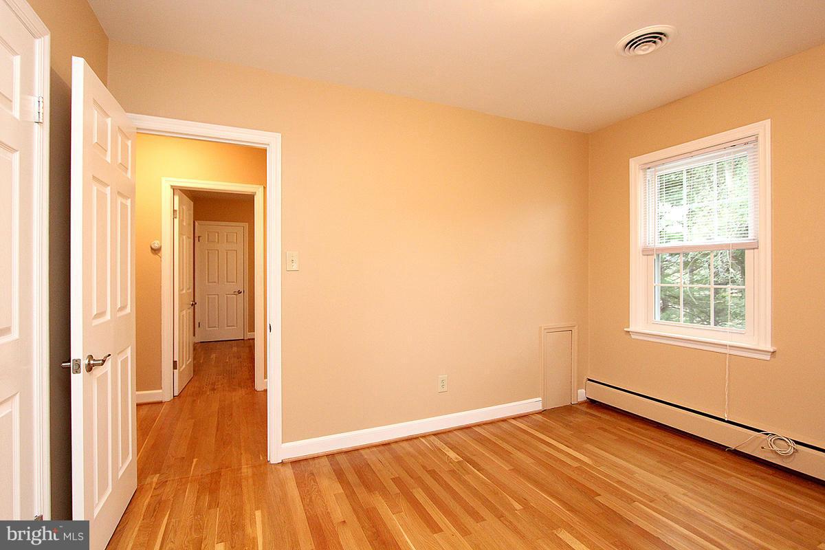 5017 Teen Barnes Road Frederick, MD 21703 - Photo 19 of 30 a view of a room with wooden floor and a window