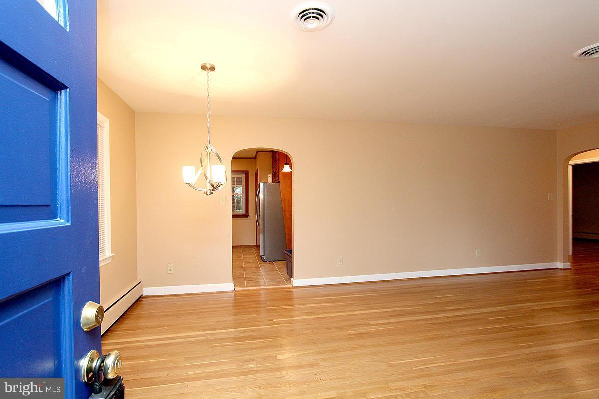5017 Teen Barnes Road Frederick, MD 21703 - Photo 5 of 30 a view of an empty room with wooden floor