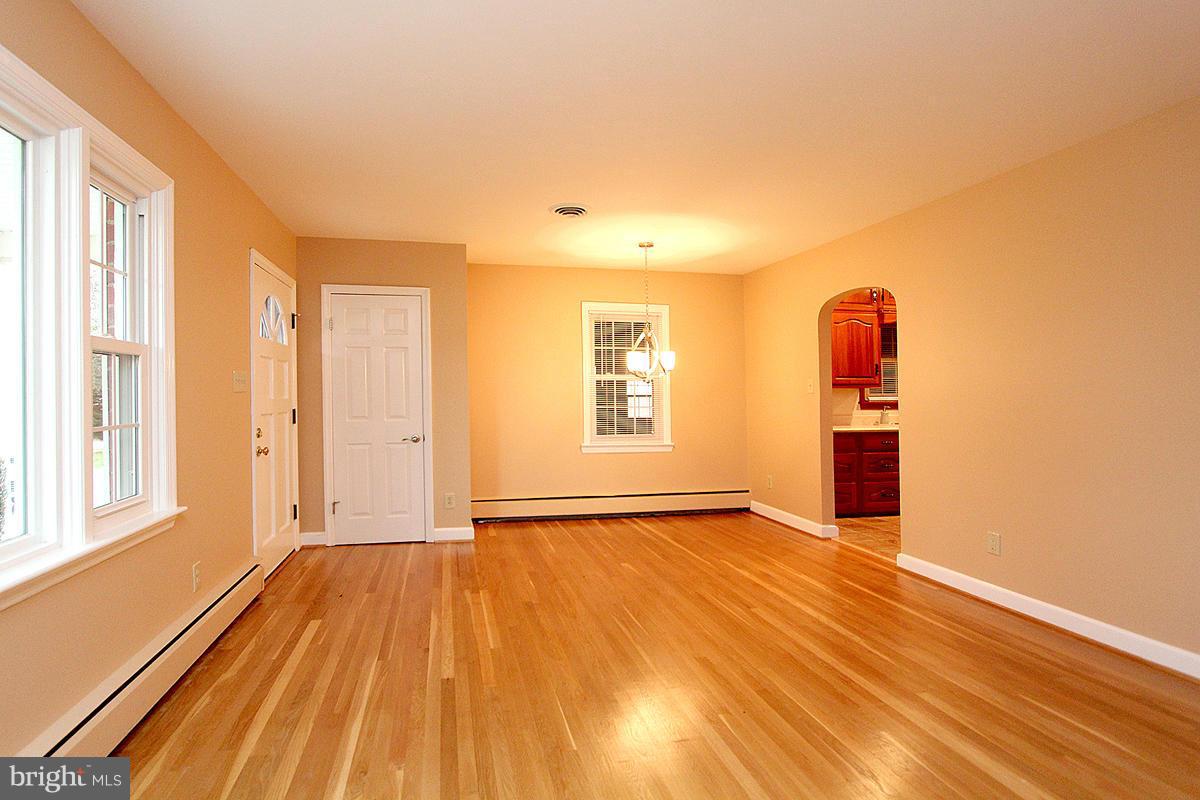 5017 Teen Barnes Road Frederick, MD 21703 - Photo 8 of 30 an empty room with wooden floor and windows