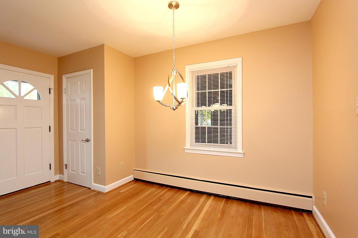 5017 Teen Barnes Road Frederick, MD 21703 - Photo 9 of 30 an empty room with wooden floor and windows