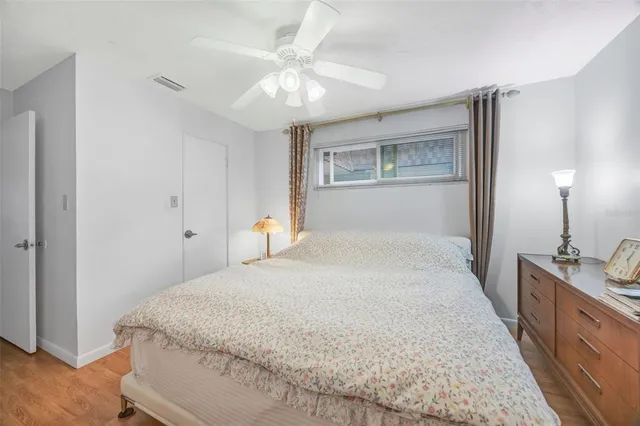 a bed room with a bed and a dresser