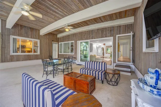a view of a dining room with furniture window and outside view
