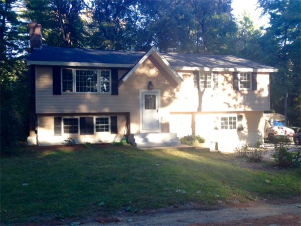3 Lake Ridge Drive Holland, MA 01521 - Photo 1 of 9 a front view of house with yard