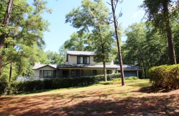 325 Ridge Lake Road Crestview, FL 32536 - Photo 1 of 64 a front view of a house with a yard