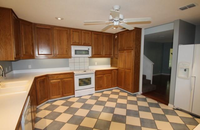 325 Ridge Lake Road Crestview, FL 32536 - Photo 2 of 64 a kitchen with stainless steel appliances granite countertop a refrigerator and a stove