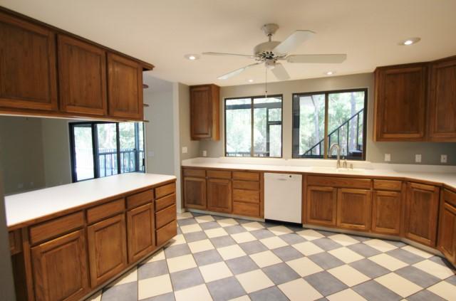 325 Ridge Lake Road Crestview, FL 32536 - Photo 14 of 64 a large kitchen with stainless steel appliances granite countertop a sink and cabinets