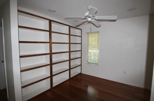 325 Ridge Lake Road Crestview, FL 32536 - Photo 15 of 64 a view of empty room with wooden floor and fan