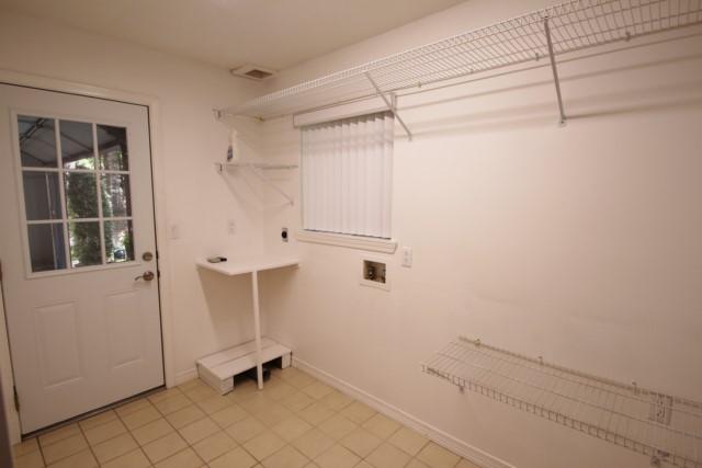 325 Ridge Lake Road Crestview, FL 32536 - Photo 17 of 64 a view of a room with racks on the wall