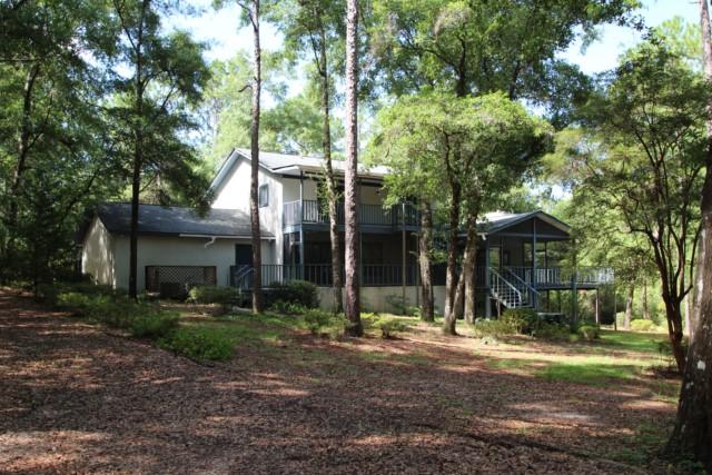 325 Ridge Lake Road Crestview, FL 32536 - Photo 20 of 64 a view of a house with a yard