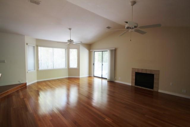 325 Ridge Lake Road Crestview, FL 32536 - Photo 23 of 64 a view of an empty room with wooden floor and a window