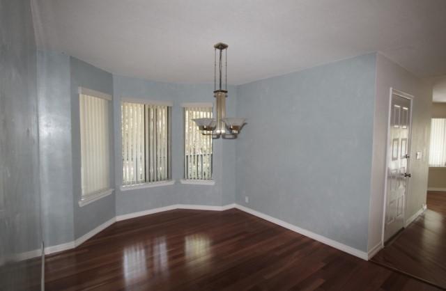 325 Ridge Lake Road Crestview, FL 32536 - Photo 24 of 64 a view of empty room with wooden floor and fan