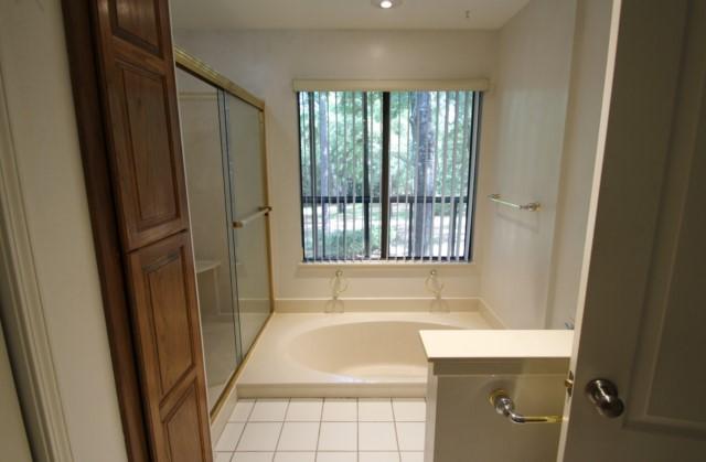 325 Ridge Lake Road Crestview, FL 32536 - Photo 26 of 64 a bathroom with a bathtub and shower