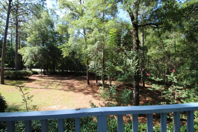 325 Ridge Lake Road Crestview, FL 32536 - Photo 44 of 64 a view of a yard with wooden fence