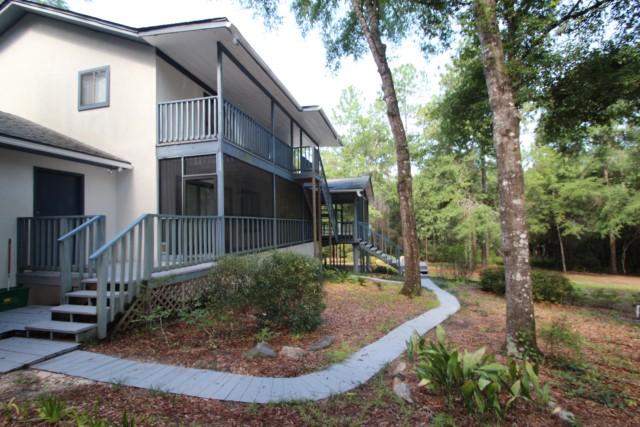 325 Ridge Lake Road Crestview, FL 32536 - Photo 53 of 64 a view of a house with a yard