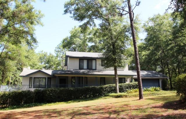 325 Ridge Lake Road Crestview, FL 32536 - Photo 61 of 64 a front view of a house with garden