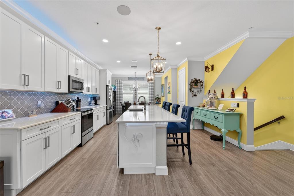 829 Callista Cay Loop Tarpon Springs, FL 34689 - Photo 11 of 91 a large white kitchen with lots of counter space a sink appliances and cabinets