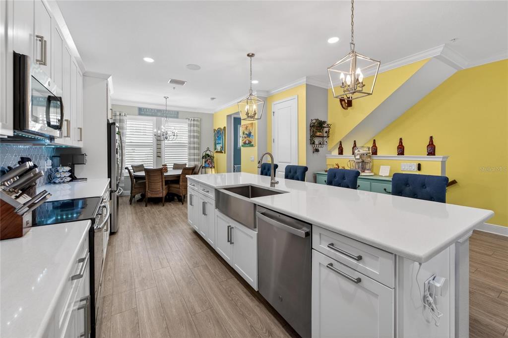 829 Callista Cay Loop Tarpon Springs, FL 34689 - Photo 18 of 91 a large kitchen with a table and chairs