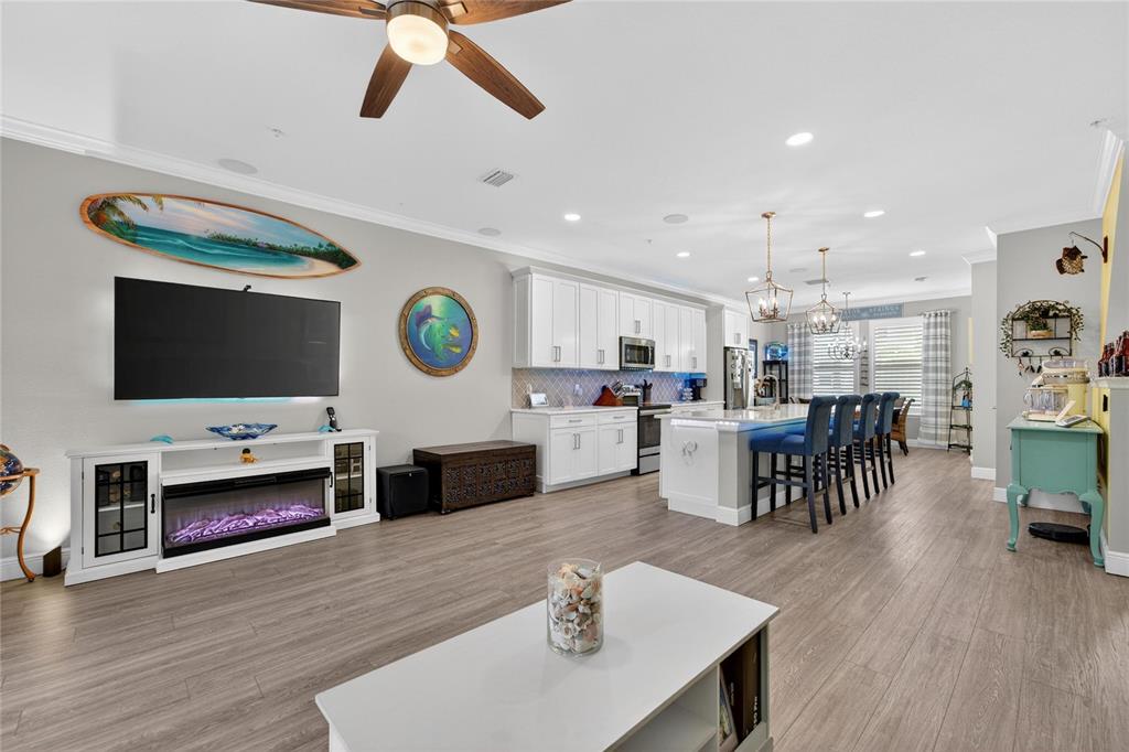829 Callista Cay Loop Tarpon Springs, FL 34689 - Photo 20 of 91 a living room with stainless steel appliances furniture and a flat screen tv