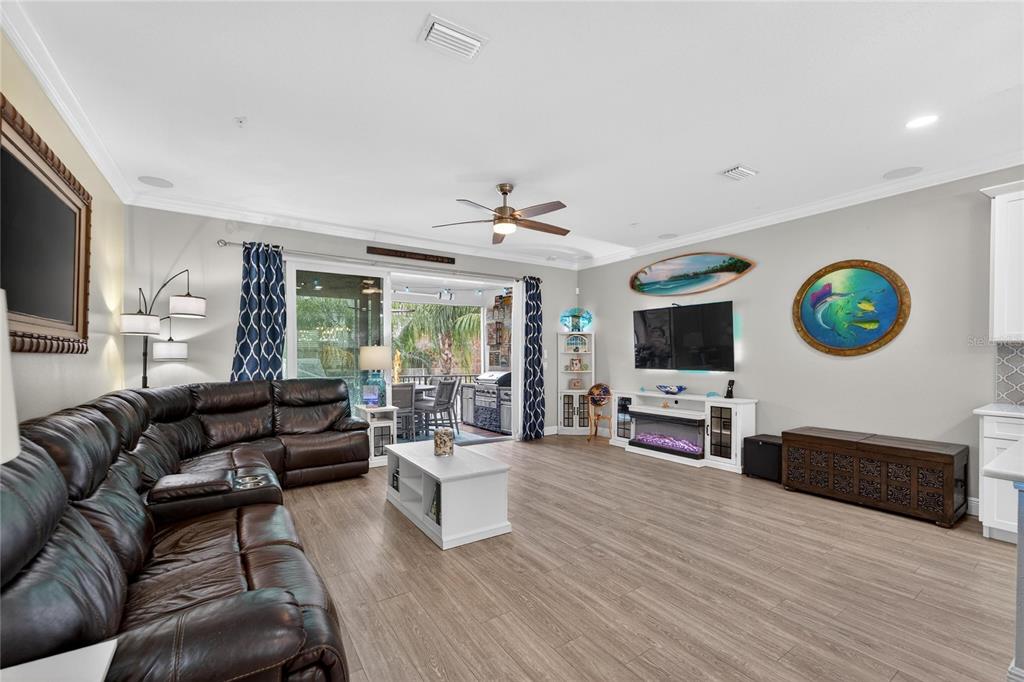 829 Callista Cay Loop Tarpon Springs, FL 34689 - Photo 21 of 91 a living room with fireplace furniture and a flat screen tv