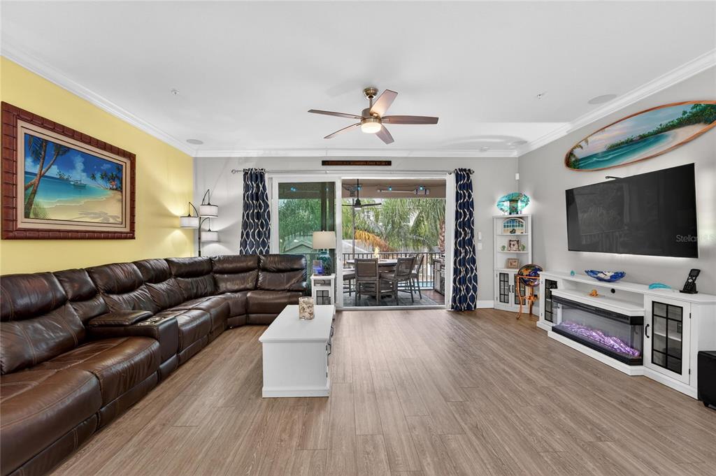 829 Callista Cay Loop Tarpon Springs, FL 34689 - Photo 23 of 91 a living room with furniture and a flat screen tv