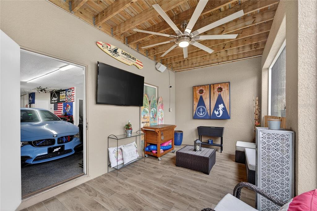 829 Callista Cay Loop Tarpon Springs, FL 34689 - Photo 29 of 91 a living room with furniture and a flat screen tv
