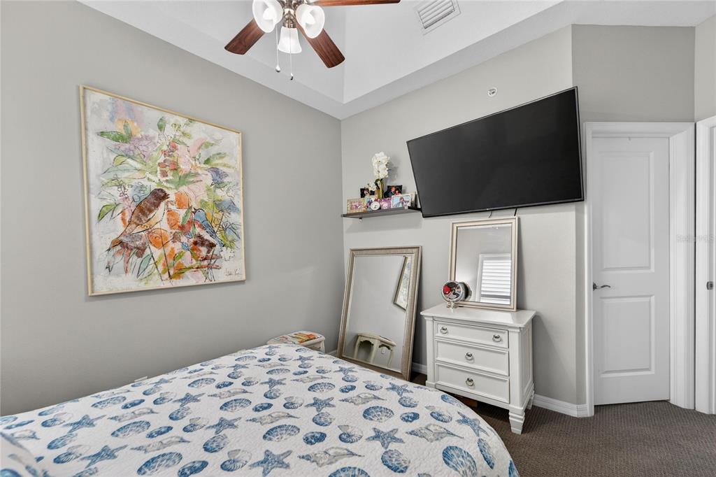 829 Callista Cay Loop Tarpon Springs, FL 34689 - Photo 47 of 91 a bedroom with a bed and a flat screen tv