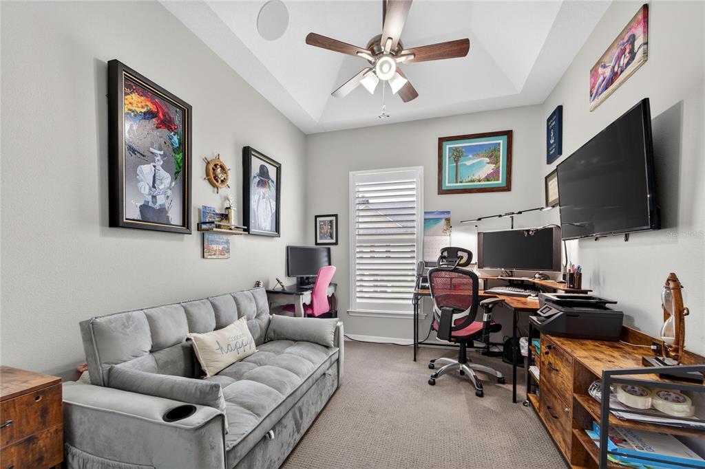 829 Callista Cay Loop Tarpon Springs, FL 34689 - Photo 49 of 91 a living room with furniture and a flat screen tv