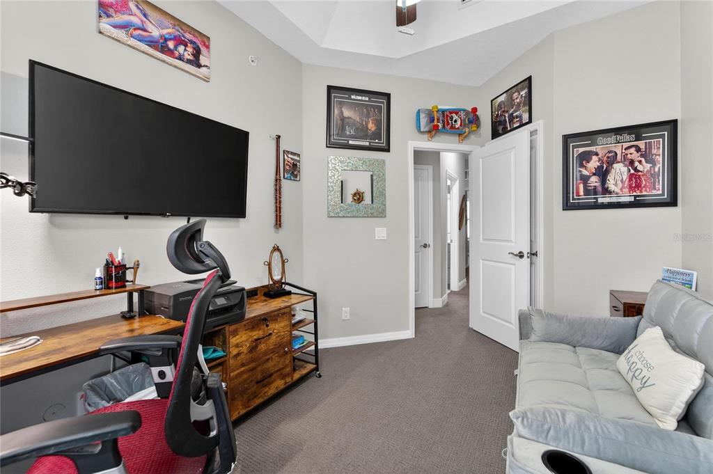 829 Callista Cay Loop Tarpon Springs, FL 34689 - Photo 51 of 91 a living room with furniture and a flat screen tv