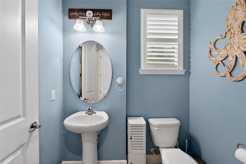 829 Callista Cay Loop Tarpon Springs, FL 34689 - Photo 57 of 91 a bathroom with a toilet a sink and a window