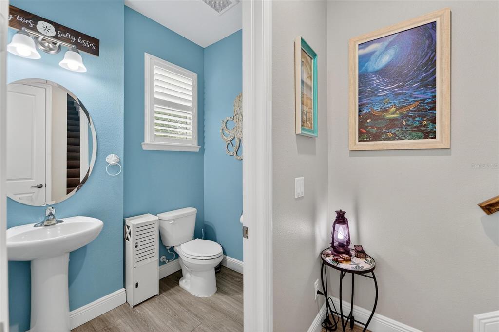 829 Callista Cay Loop Tarpon Springs, FL 34689 - Photo 59 of 91 a bathroom with a toilet sink and mirror