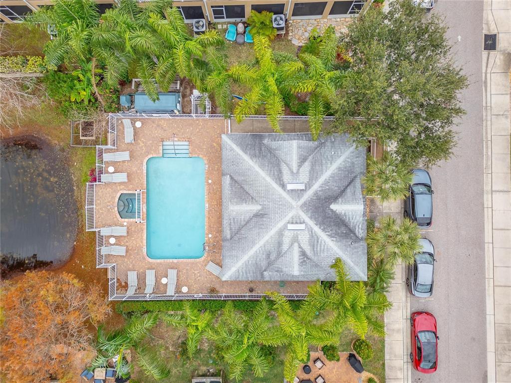 829 Callista Cay Loop Tarpon Springs, FL 34689 - Photo 77 of 91 an aerial view of a house with a yard and garden
