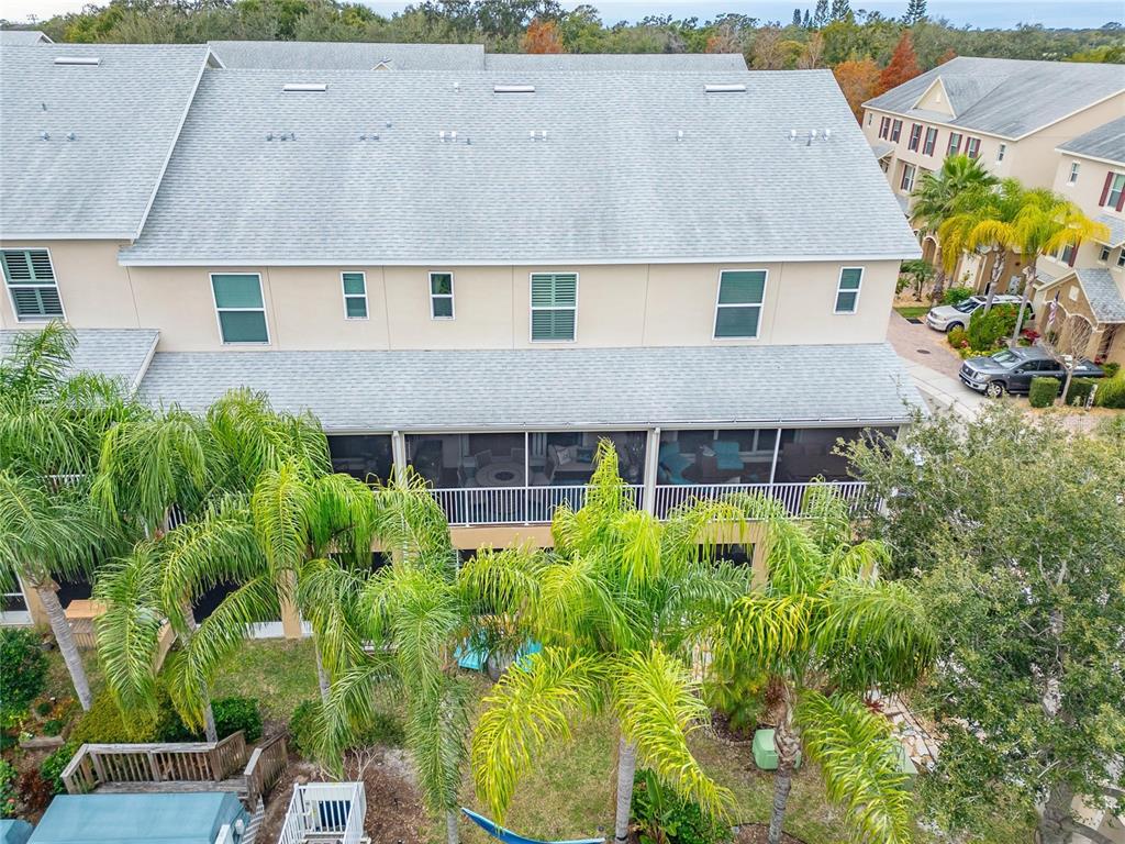 829 Callista Cay Loop Tarpon Springs, FL 34689 - Photo 90 of 91 an aerial view of a house with a yard and potted plants