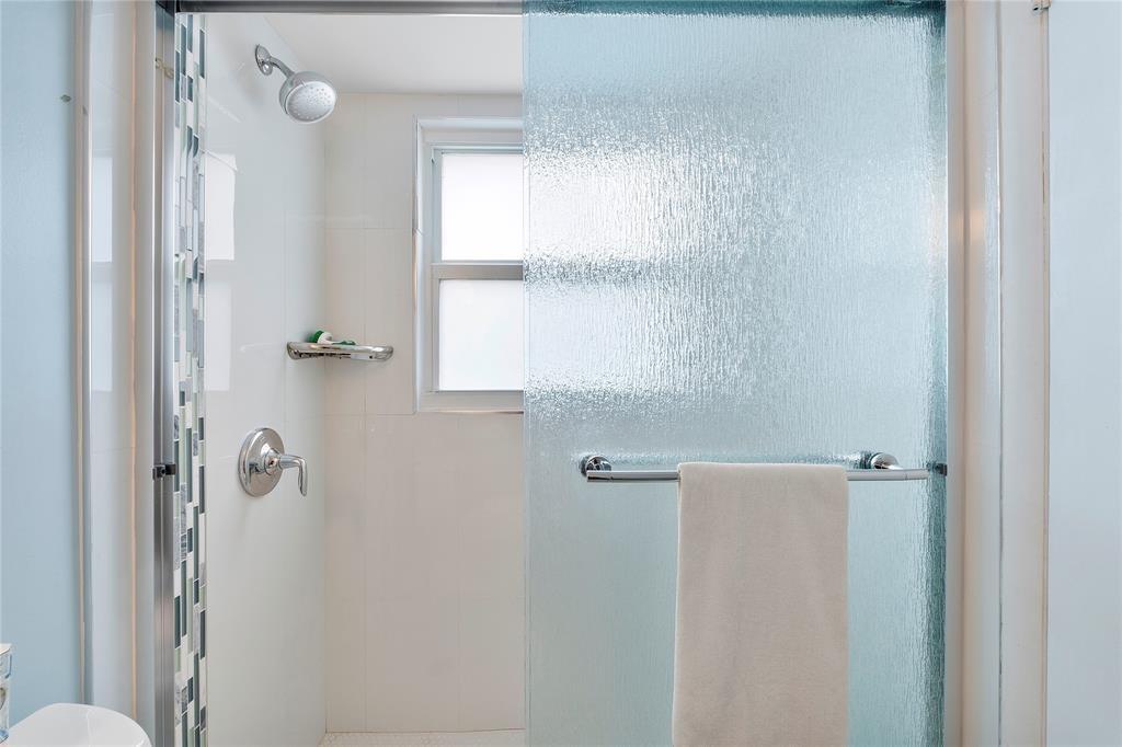 373 Tilford R, Unit 373 Deerfield Beach, FL 33442 - Photo 13 of 36 a bathroom with a shower