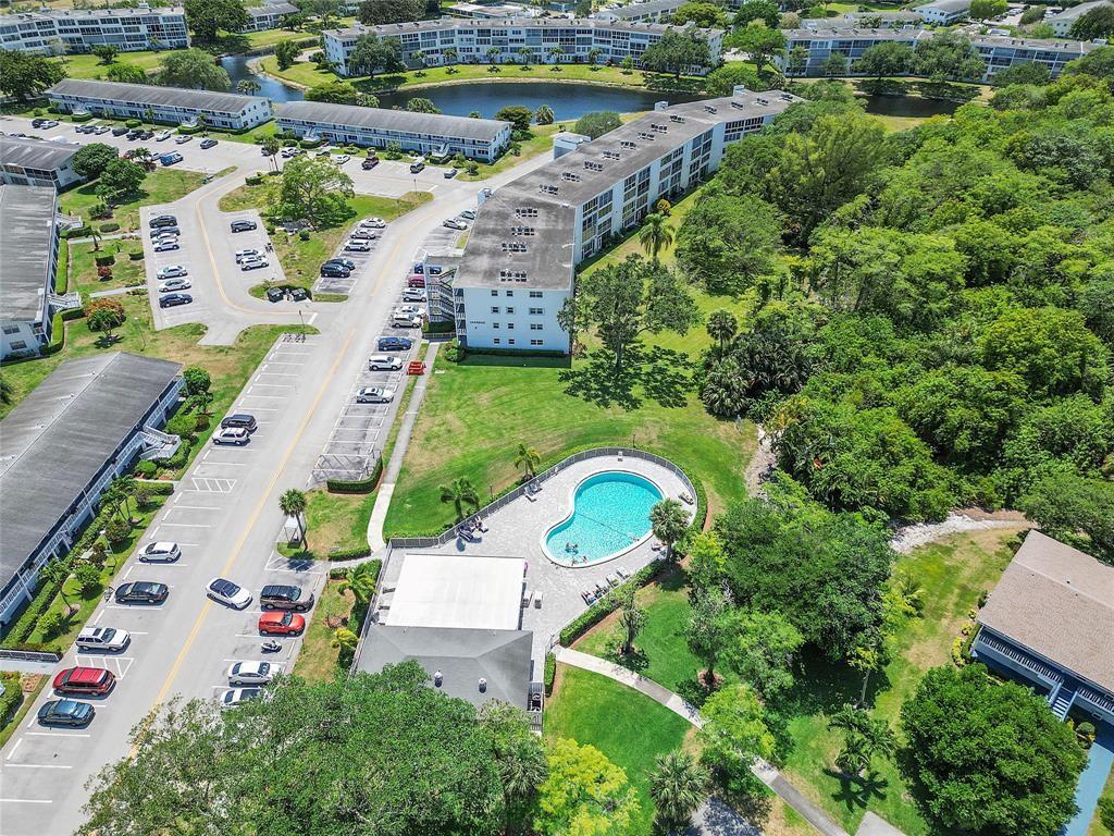 373 Tilford R, Unit 373 Deerfield Beach, FL 33442 - Photo 16 of 36 an aerial view of a house with a garden and lake view
