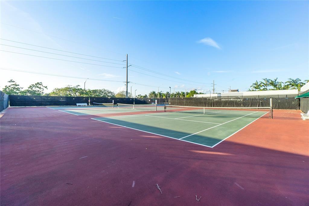 373 Tilford R, Unit 373 Deerfield Beach, FL 33442 - Photo 34 of 36 a view of a tennis court