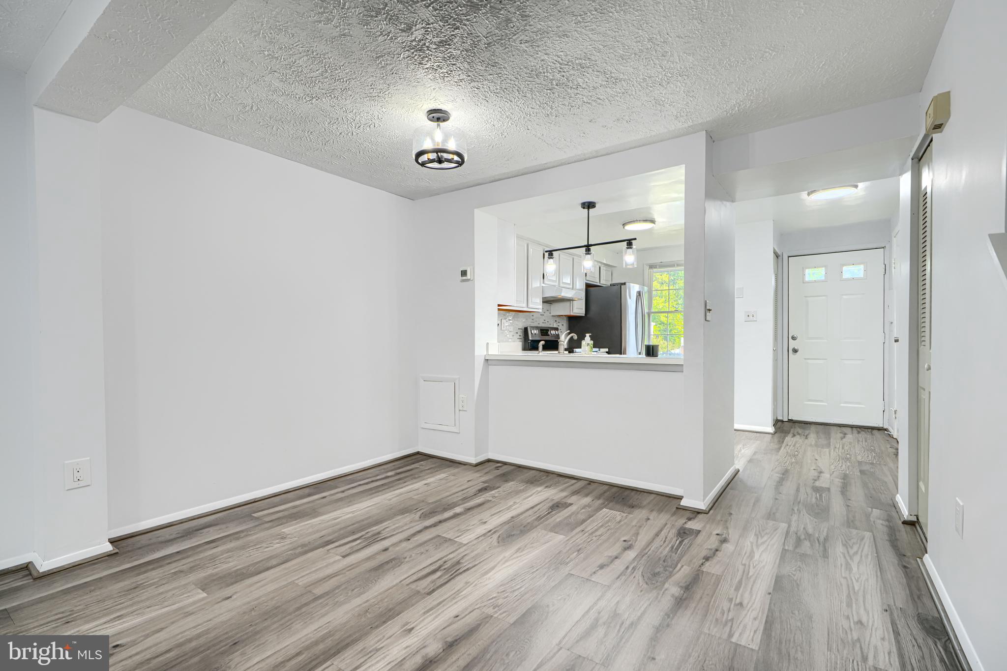 6 Stillwood Circle Nottingham, MD 21236 - Photo 11 of 26 a view of a kitchen with a sink and dishwasher wooden floor
